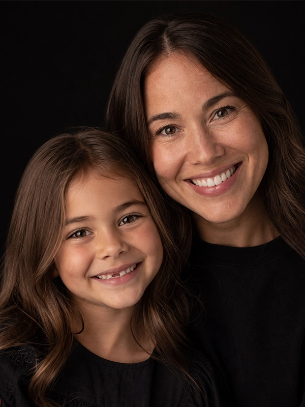 mother and daughter smiling